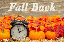 Fall Back Time Change Message With A Retro Alarm Clock With Pumpkins And Fall Leaves