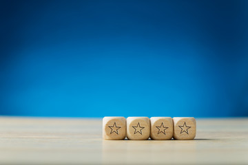 Wall Mural - four stars on wooden dices