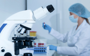 Poster - Woman scientist preparing samples with blood for researching