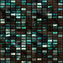 .265/5000.Building Facade At Night With Some Windows Illuminated And Some Not. Urban Night Detail.