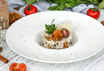 Wall Mural - mushroom truffle risotto garnished with parmesan and parsley