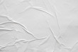 Leinwandbild Motiv Blank white crumpled and creased paper poster texture background