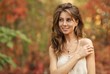 portrait of a beautiful girl on a background of autumn leaves. Blurred background