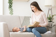 © Prostock-studio - Loving mother reading fairy tale to her newborn baby.