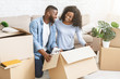 © Prostock-studio - Excited black couple getting ready for moving out