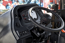 Steering Wheel And The Controls In The Cabin Of The New Tractor