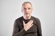© amixstudio - Gray-haired Caucasian elderly man put his hand on chest with questioning expression on face isolated in white studio. Concept me, meyself and i, my soul