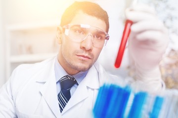 Poster - Hand holding syringe and vaccine.