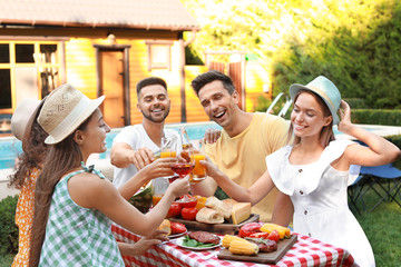 Wall Mural - Happy friends with drinks having fun at barbecue party outdoors