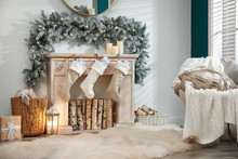 Fireplace With Christmas Stockings In Festive Room Interior