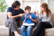 © Elnur - Concept of underage smoking with young boy and family