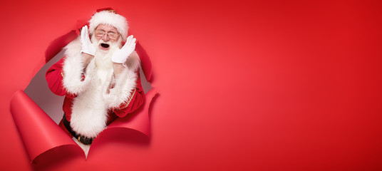 emotional santa claus on the red background.