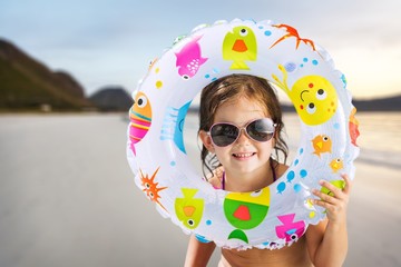 Poster - Beautiful little girl sunning at the pool