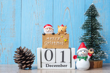 1 December Calendar With Christmas Decoration, Snowman, Santa Claus And Pine Tree  On Wooden Table Background, Preparation For Holiday, Happy New Year And Xmas Concept