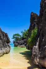 Limestone Large Rocks On Bagieng Island Beach, Caramoan, Camarines Sur Province, Luzon In The Philippines. Vertical View.
