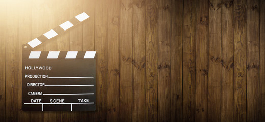 Movie clapper board on wooden background