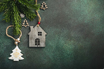 festive background with toy wooden house christmas tree and decoration. copy space, winter holidays 