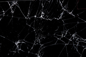 Aufkleber - cracked glass isolated on a black background.