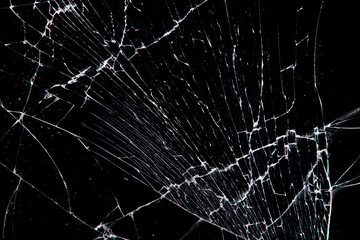 Aufkleber - cracked glass isolated on a black background.