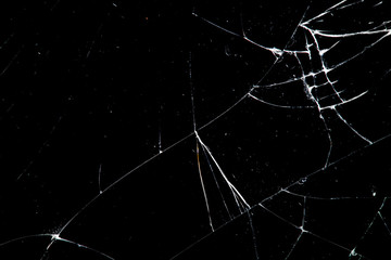 Poster - cracked glass isolated on a black background.