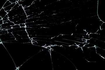 Aufkleber - cracked glass isolated on a black background.