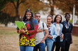 © AS Photo Family - Row of group five african college students spending time together on campus at university yard. Black afro friends studying. Education theme.
