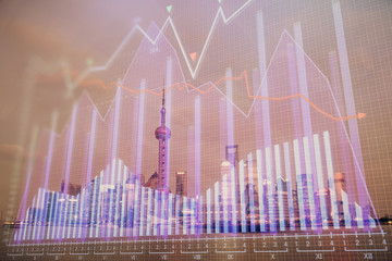 Forex chart on cityscape with tall buildings background multi exposure. Financial research concept.