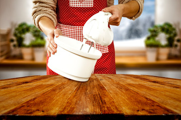 Wall Mural - Woman hands making cake in kitchen and free space for your decoration. 