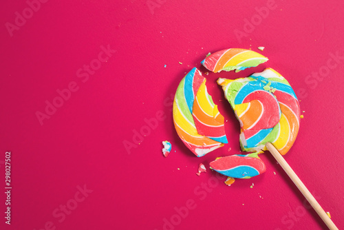 Swirl round broken lollipop on pink background Tableau sur Toile