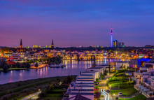 Amazing Panoramic View Of Phoenix Lake In Dortmund, Germany Over City Skyline And Florian Tower Illuminated At Twilight