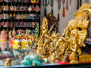 Wall Mural - Rishikesh, India. Small bronze statuettes on the street market in Rishikesh.