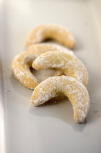 White Vanilla Crescents Rolls Delicious Cookies With Sugar Icing On White Plate, Hazelnut Pastry
