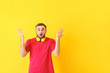 © Pixel-Shot - Surprised young man with headphones on color background