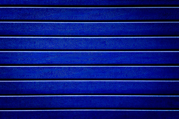 Wall Mural - siding texture background is blue. plastic fence Board. blue tone artificial wood wall background texture abstraction