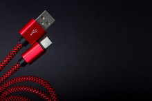 Red USB Cable For Smartphone Isolated On White Background.