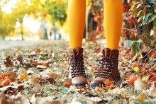 Legs Of Beautiful Young Woman In Stylish Shoes In Autumn Park