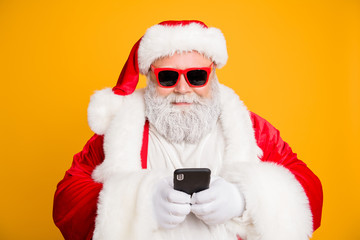 Sticker - Close up photo of funny cool overweight santa claus in red hat headwear using smartphone search winter season tradition sales end x-mas 2020 greetings isolated over bright color background