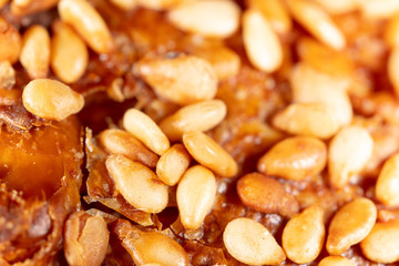 Sesame seeds on a brown crust of bread