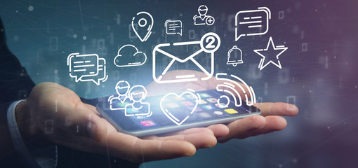 Businessman holding a cloud of social media network icon