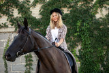 Fototapeta Konie - Girl riding a horse, Young girl riding a horse