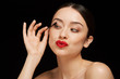 © Leandro Crespi/Stocksy - Woman classic beauty portrait using mascara