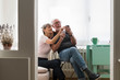 © Garage Island Crew/Stocksy - Senior couple using a phone at home