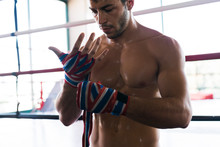 Athlete Wrapping His Hands With Stripes