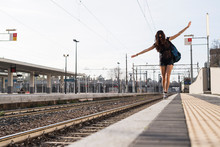Young Woman Traveling In Railway Station