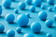 © 365mm/Stocksy - Layout of various blue balls