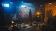 © Gorodenkoff - Talented Female Artist Works on Abstract Oil Painting, Using Paint Brush She Creates Modern Masterpiece. Dark and Messy Creative Studio where Large Canvas Stands on Easel Illuminated.