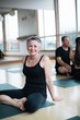 © Rob and Julia Campbell/Stocksy - Mature, older yoga woman portrait.