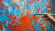 © Gorodenkoff - Close-up Shot of Female Artist Hand, Holding Paint Brush and Drawing Painting with Red Paint. Colorful, Emotional Oil Painting. Contemporary Painter Creating Modern Abstract Piece of Fine Art