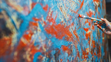 Close-up Shot Of Female Artist Hand, Holding Paint Brush And Drawing Painting With Red Paint. Colorful, Emotional Oil Painting. Contemporary Painter Creating Modern Abstract Piece Of Fine Art