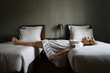 © Lumina/Stocksy - Woman at Spooky Bedroom